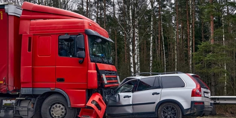 Head-on collision between a semi truck and a car