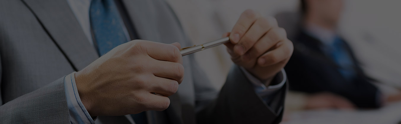 business man holding pencil
